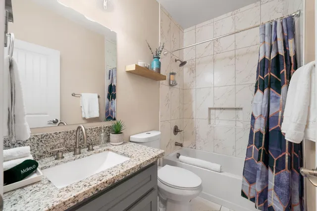 a bedroom with a bed furniture and a potted plant