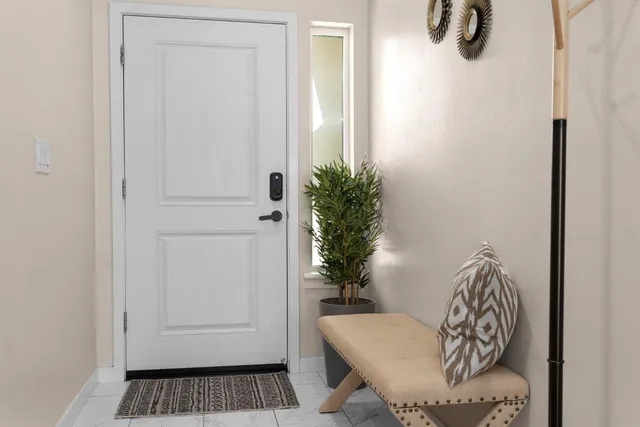 a kitchen with stainless steel appliances granite countertop a refrigerator stove and sink