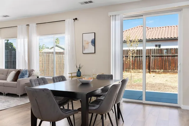 a kitchen with granite countertop a sink stainless steel appliances and cabinets
