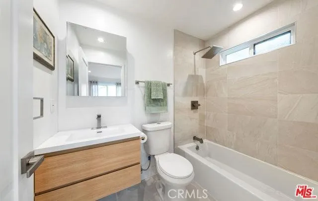 a bathroom with a sink toilet a shower and bathtub