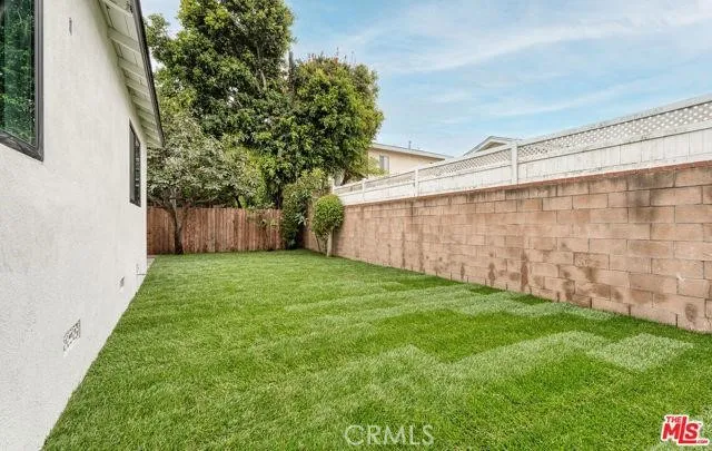 a view of a backyard with a garden