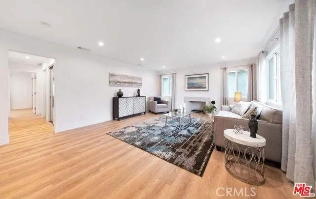 a living room with furniture and a table