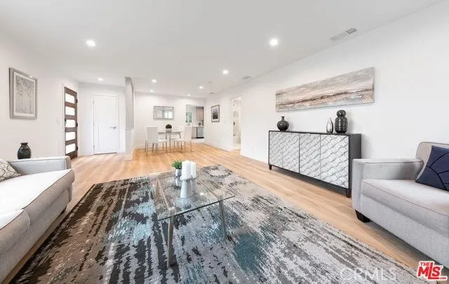 a spacious bedroom with a bed and a couch