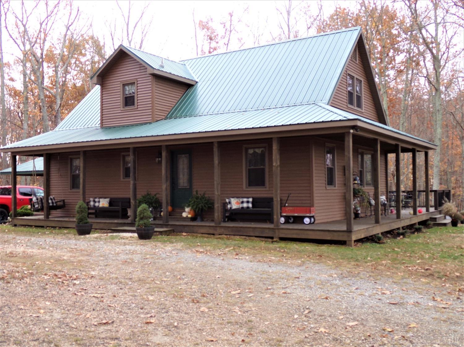 671 Countyline Road Keysville, VA 23947 - Photo 1 of 38 a view of a house with a yard and sitting area