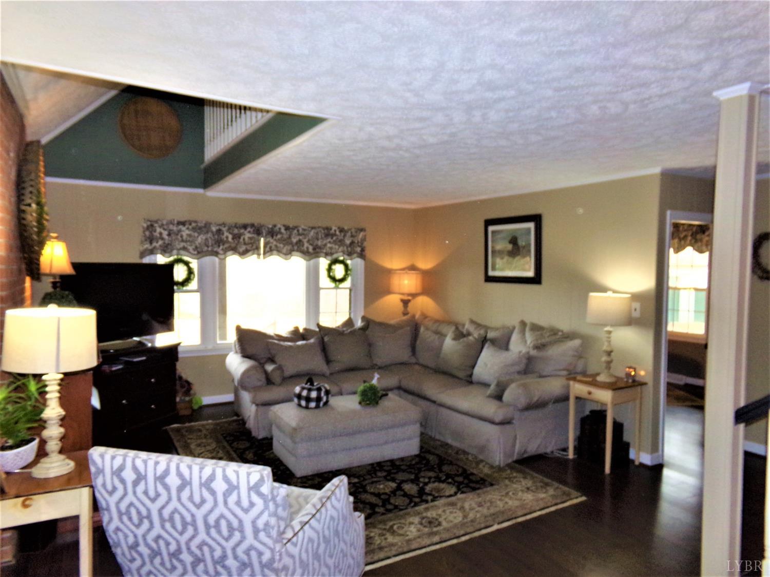 671 Countyline Road Keysville, VA 23947 - Photo 15 of 38 a living room with furniture or couch and a lamp