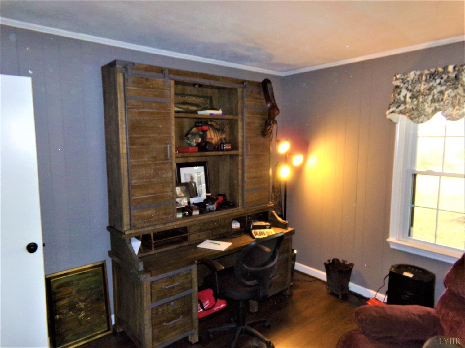 671 Countyline Road Keysville, VA 23947 - Photo 17 of 38 a room with furniture and window