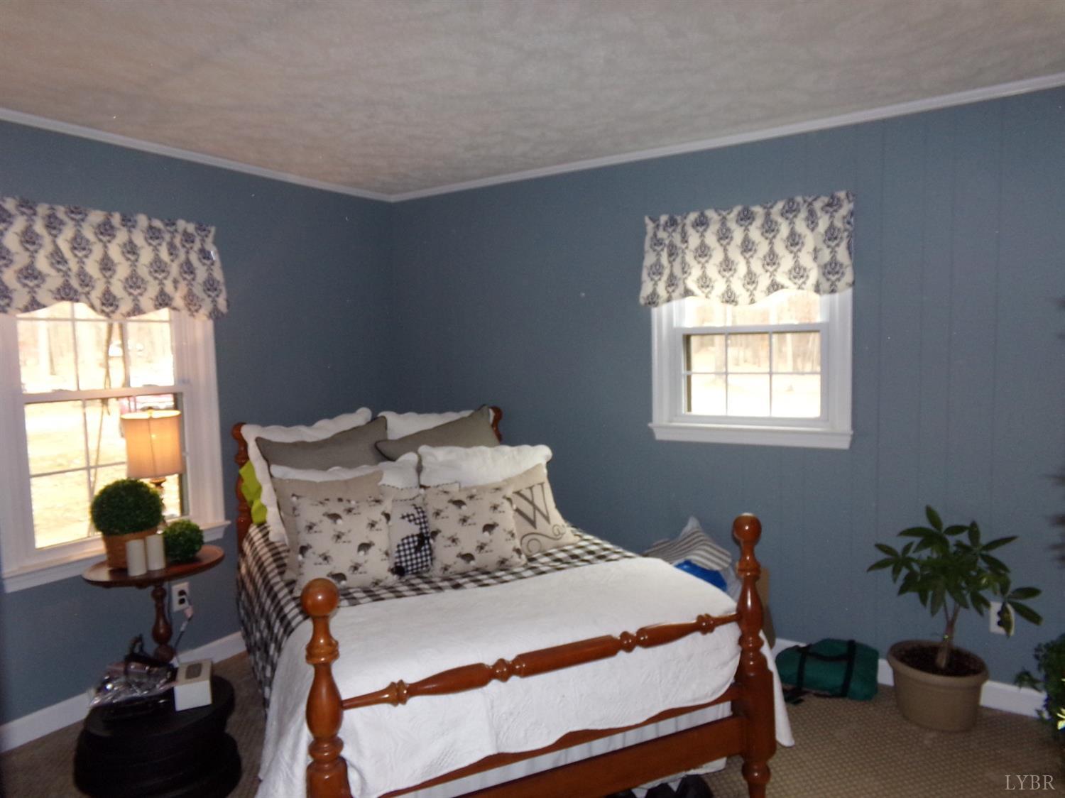 671 Countyline Road Keysville, VA 23947 - Photo 19 of 38 a bedroom with a bed and window