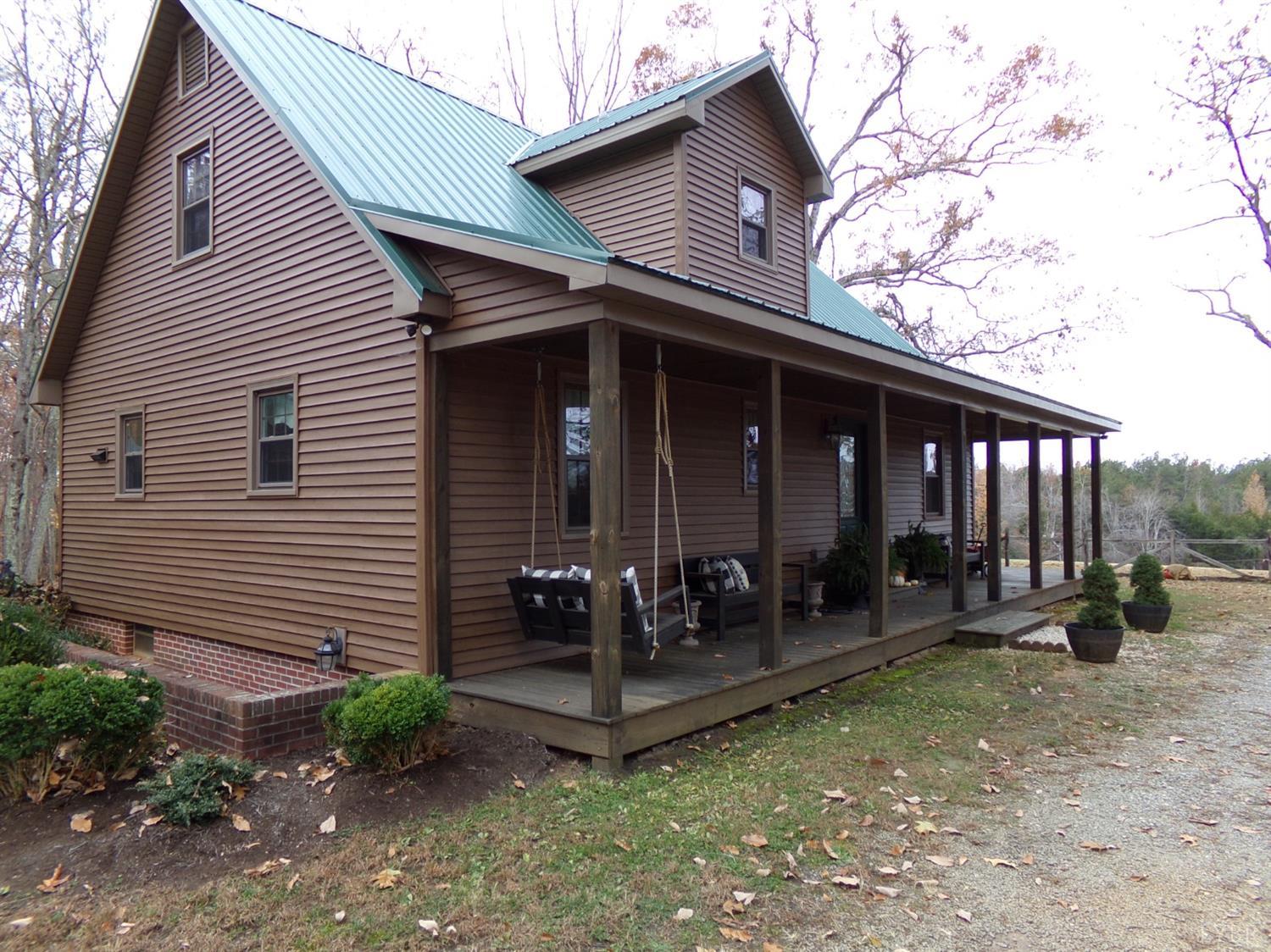 671 Countyline Road Keysville, VA 23947 - Photo 3 of 38 a view of a house with backyard porch and sitting area