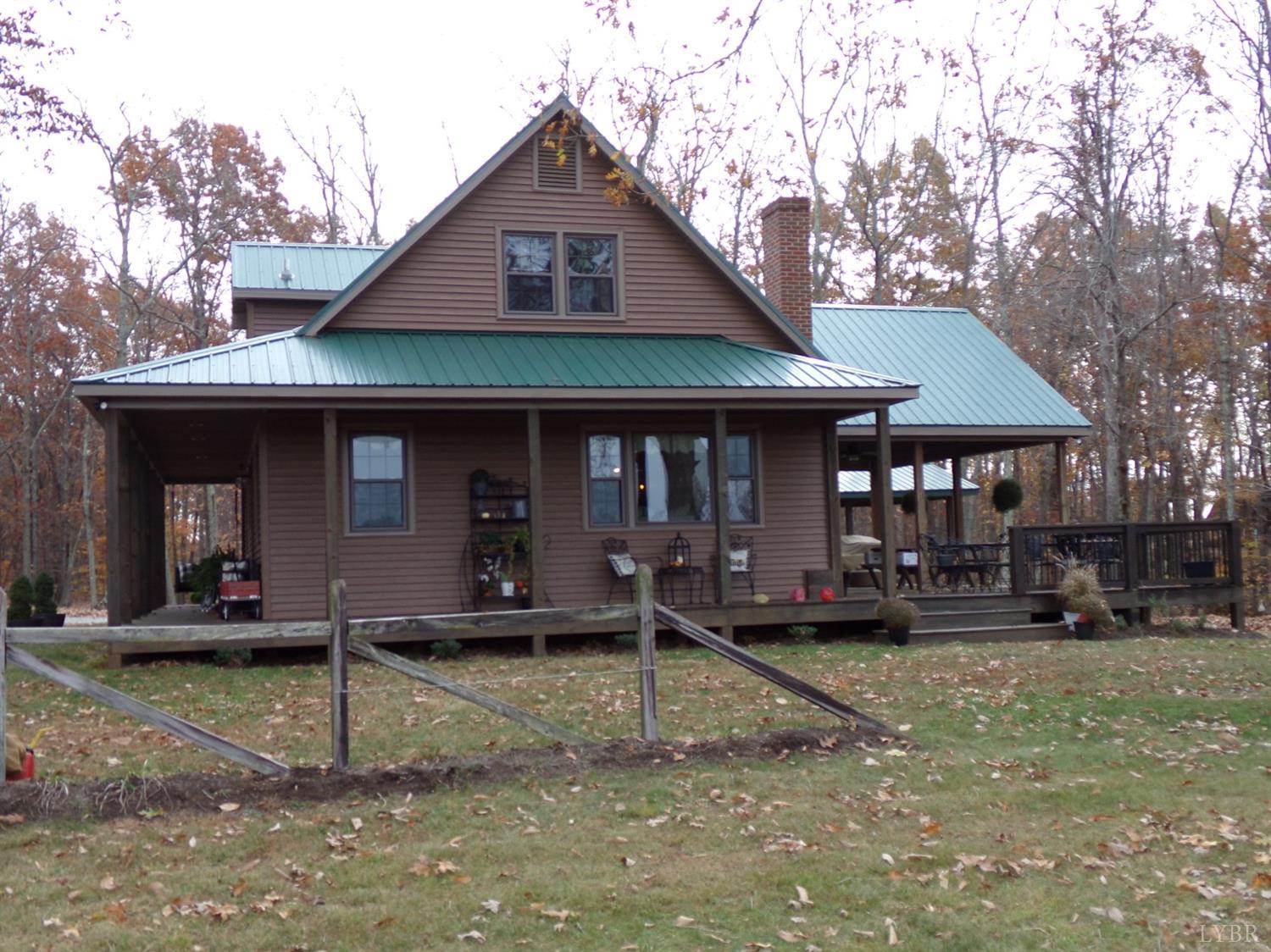 671 Countyline Road Keysville, VA 23947 - Photo 4 of 38 a front view of a house with garden