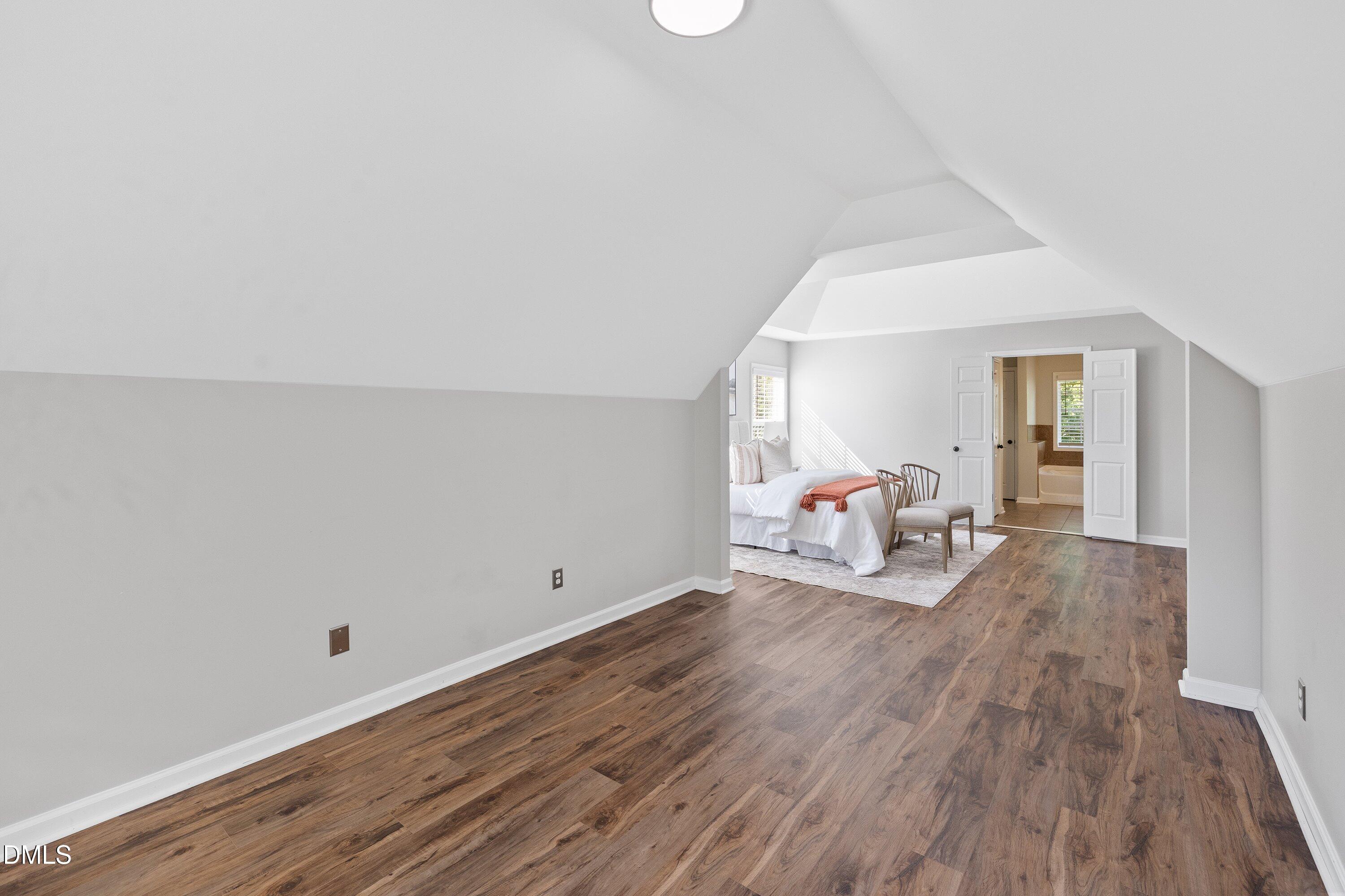 3717 Windmeade Road Wake Forest, NC 27587 - Photo 30 of 51 a view of a livingroom with wooden floor and white walls