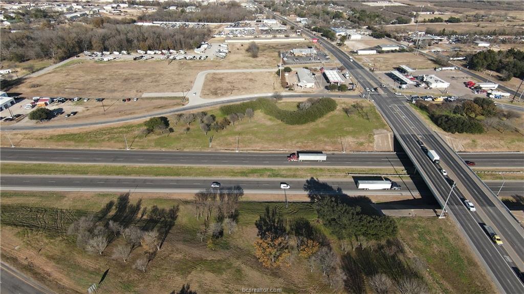 1634 North Earl Rudder Freeway Bryan, TX 77808 - Photo 4 of 7 a view of a swimming pool with a yard