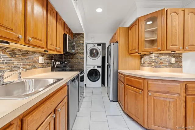 a kitchen with stainless steel appliances granite countertop a sink and cabinets