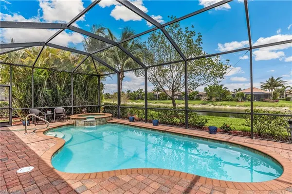 a view of swimming pool with a patio