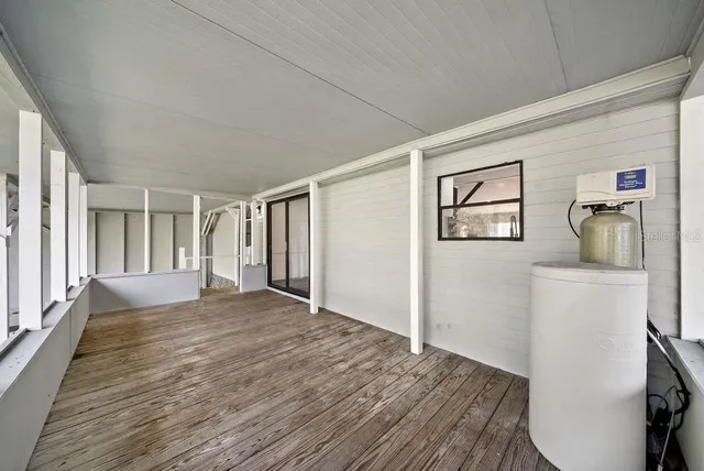 a big room with wooden floor and closet