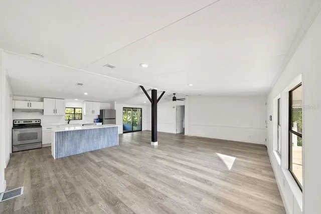 a view of a kitchen with a sink and a window