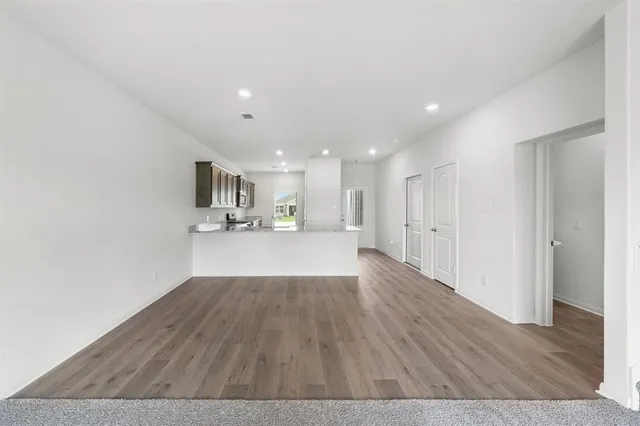 a kitchen with a sink a refrigerator and a stove