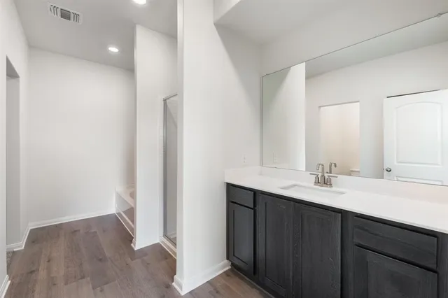 a view of an empty room and a window