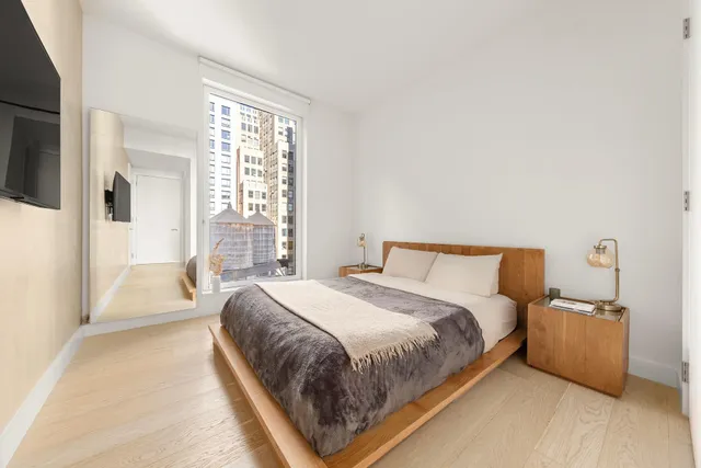 a bedroom with a bed and a couch