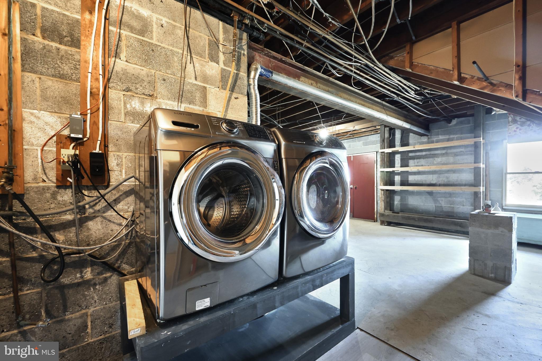 150 Ridge Avenue Glen Rock, PA 17327 - Photo 45 of 49 Modern laundry setup in a spacious basement.