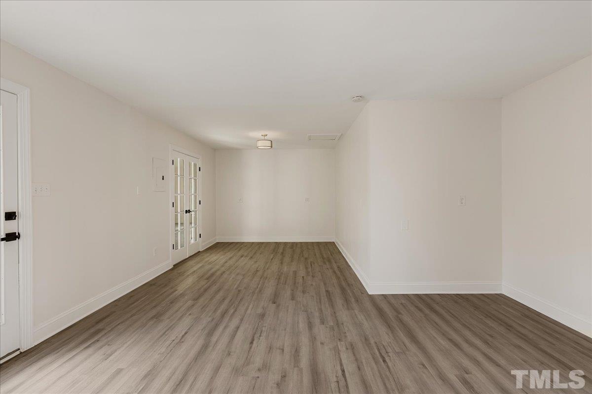 306 Barclay Road Durham, NC 27712 - Photo 54 of 70 a view of an empty room with wooden floor