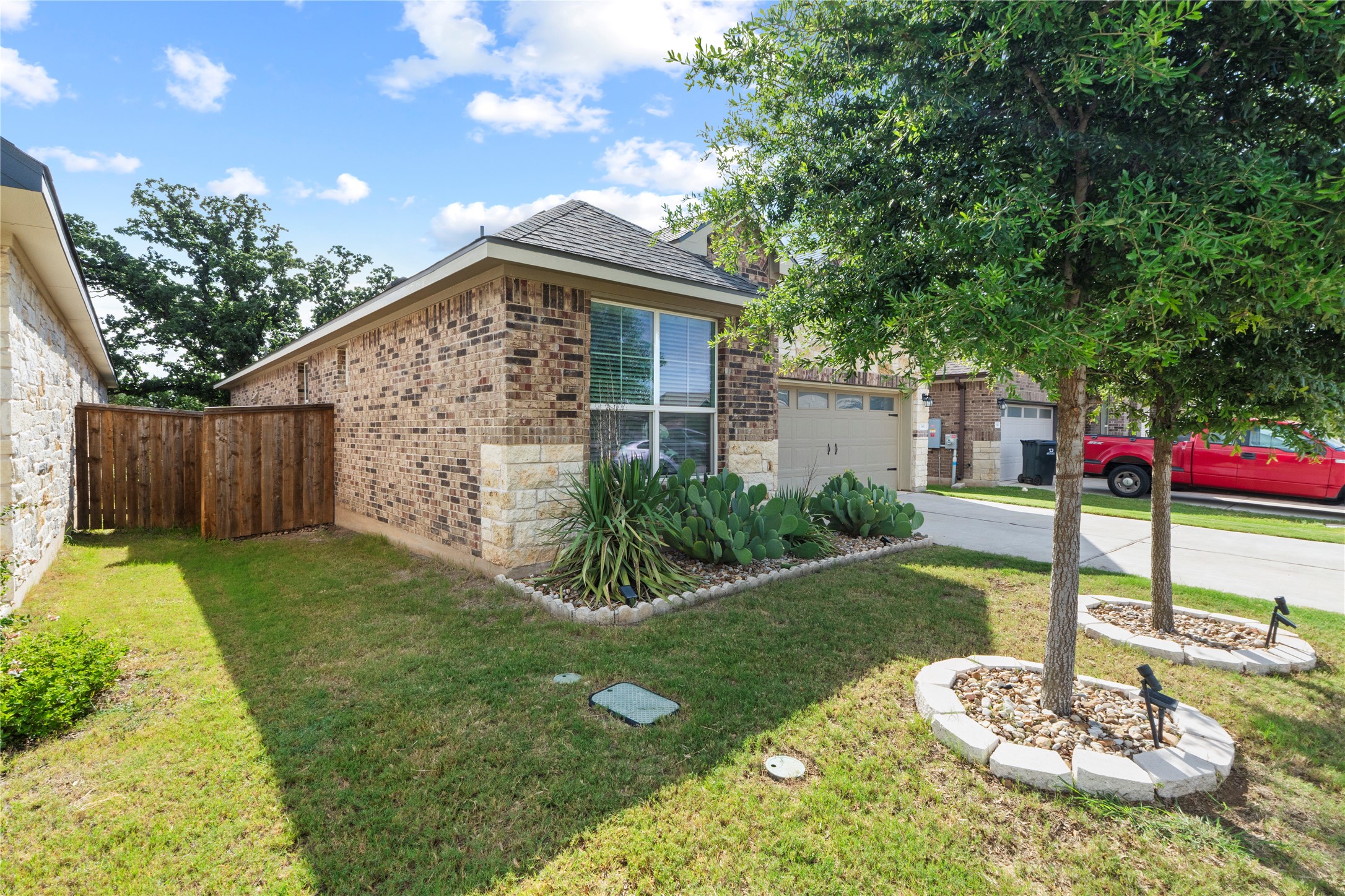 341 Peace Pipe Way Georgetown, TX 78628 - Photo 3 of 28 Stone accents and enhanced landscape adorn this front yard.