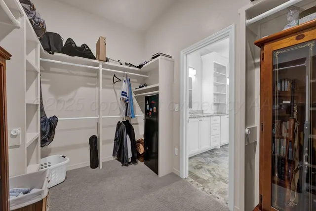 a bedroom with a bed and cabinets