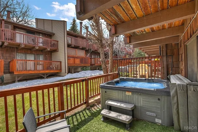a view of a house with a wooden deck