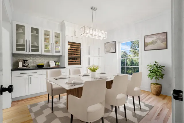 a view of a dining room with furniture window and wooden floor