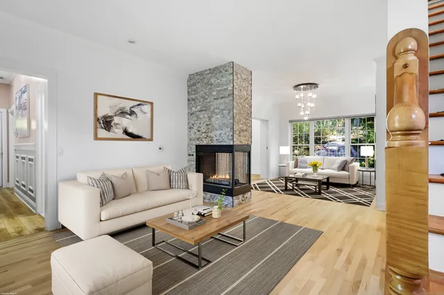 a living room with furniture fireplace and a fireplace