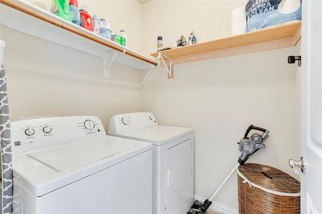 a utility room with dryer and washer
