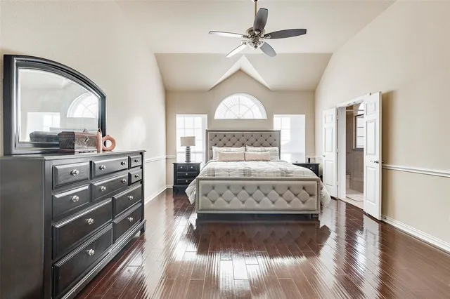 a bedroom with a bed and a dresser