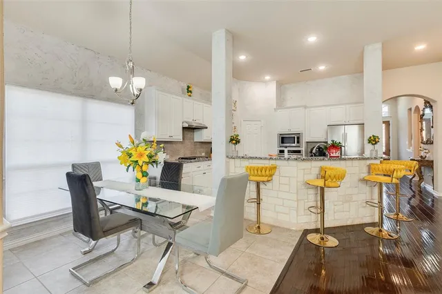 a view of kitchen and dining area with furniture