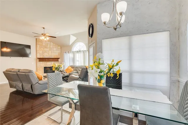 a living room with fireplace furniture and a flat screen tv