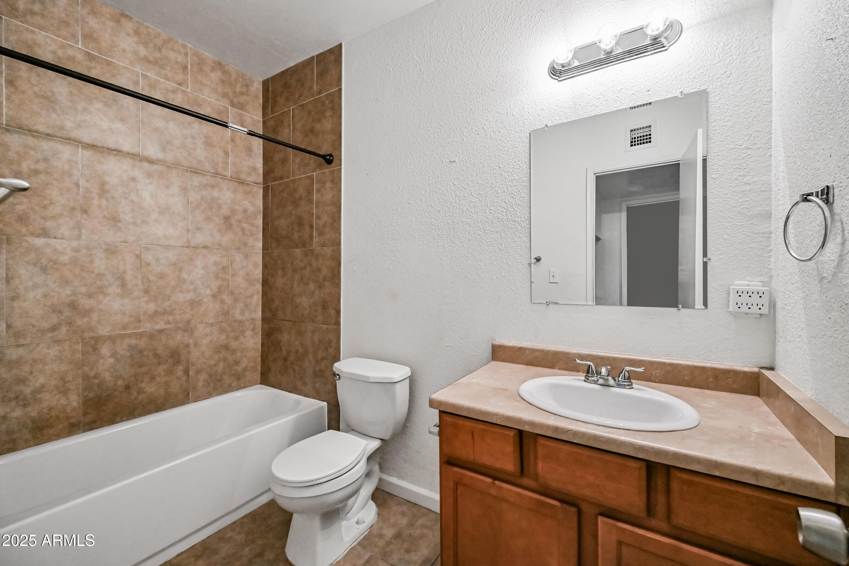 1518 West Colter Street, Unit 29 Phoenix, AZ 85015 - Photo 15 of 15 a bathroom with a sink toilet and shower