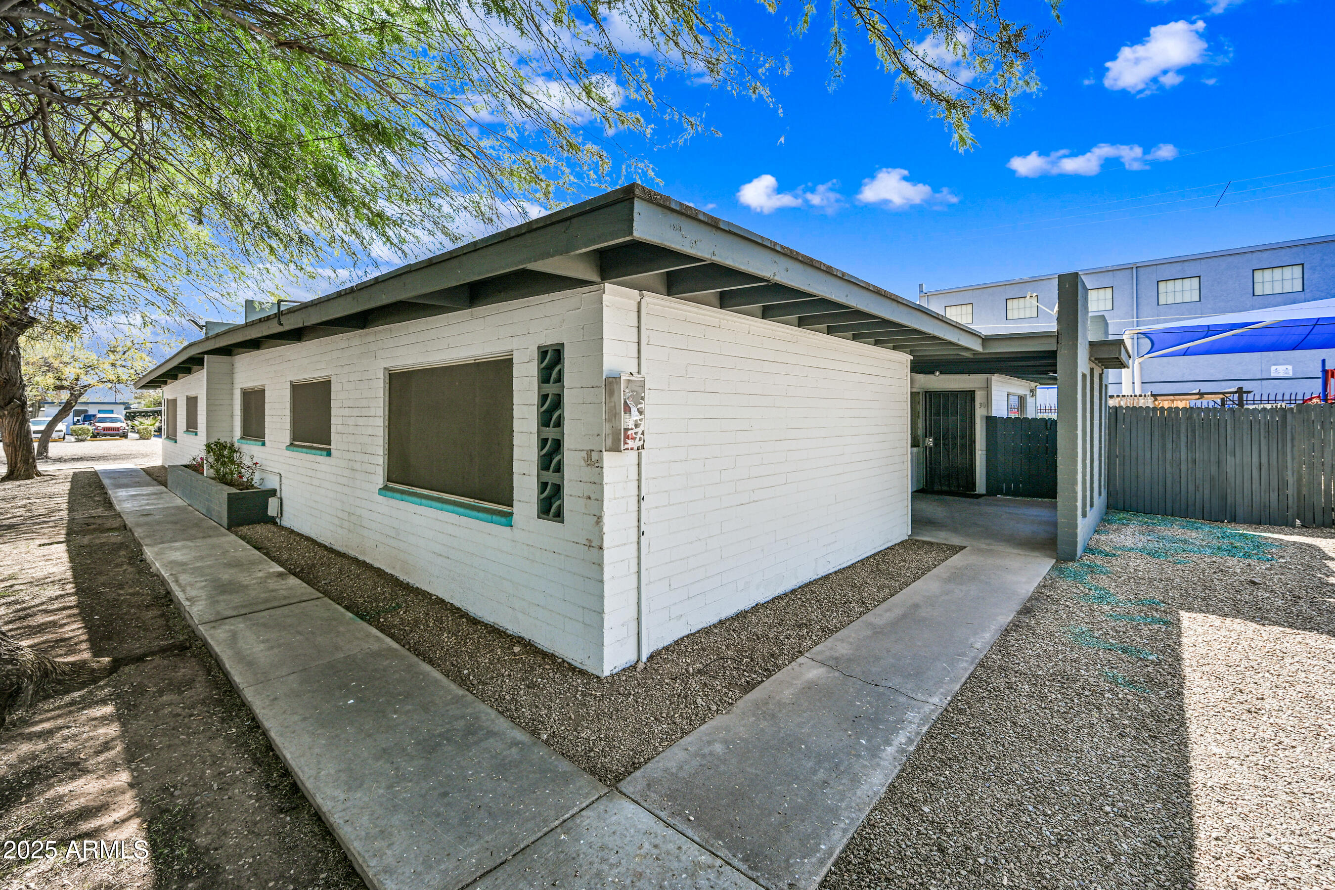 1518 West Colter Street, Unit 29 Phoenix, AZ 85015 - Photo 3 of 15 a view of a house with a yard