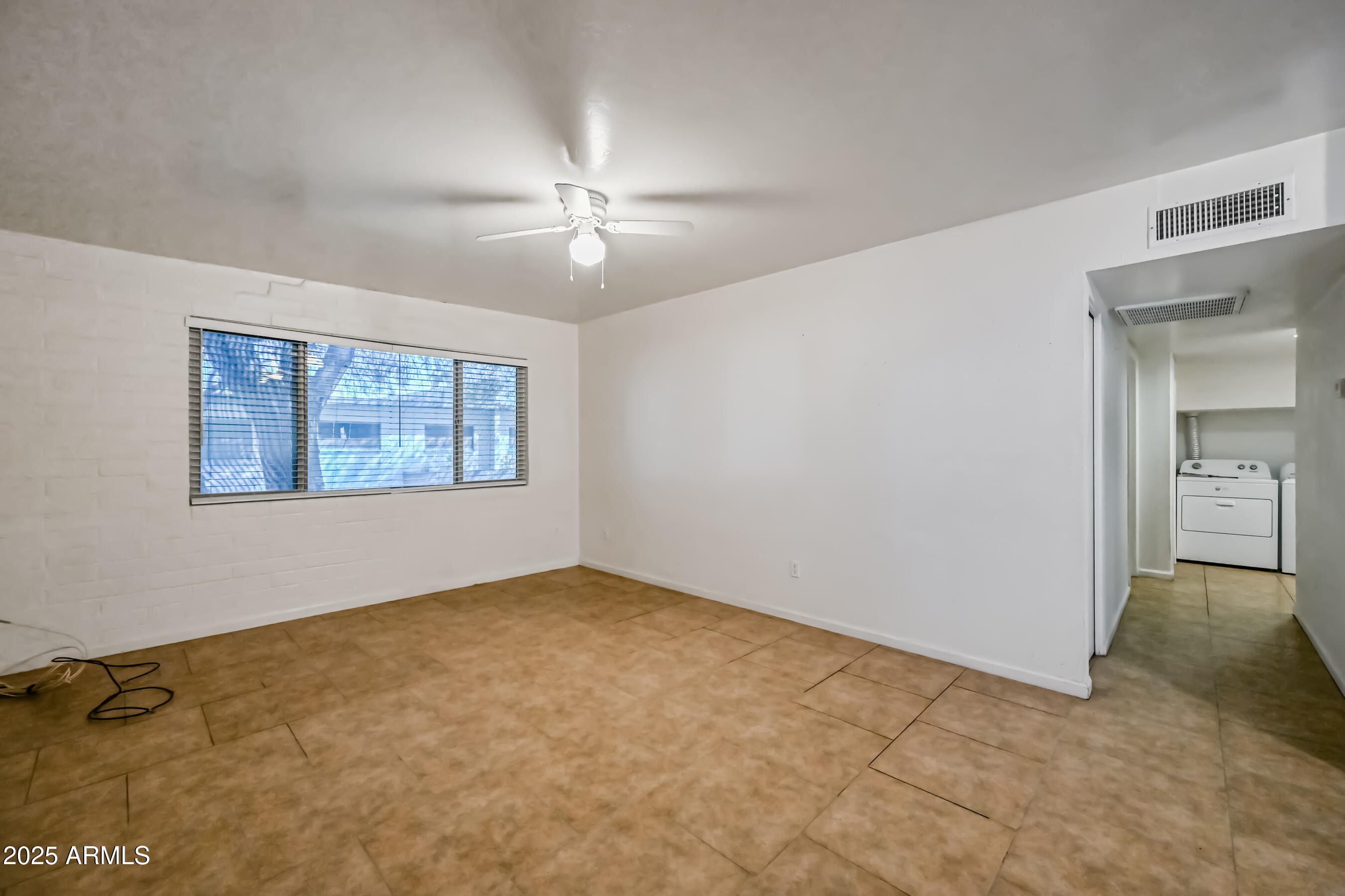 1518 West Colter Street, Unit 29 Phoenix, AZ 85015 - Photo 5 of 15 a view of an empty room with a window