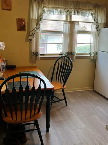 a view of a porch with furniture and a window