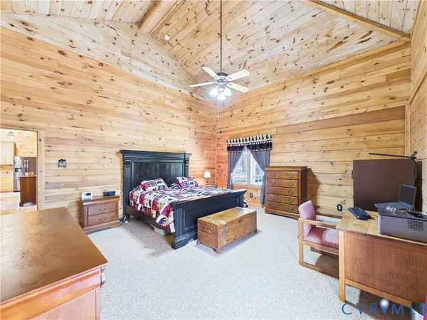 a bedroom with furniture and a fireplace