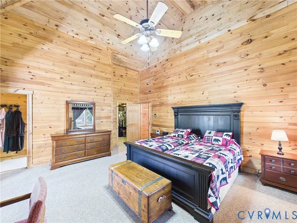 a bedroom with a bed and dresser
