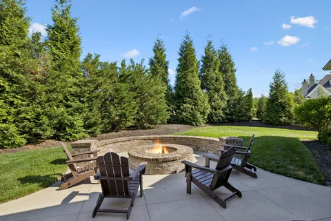 a view of a swimming pool and lounge chairs