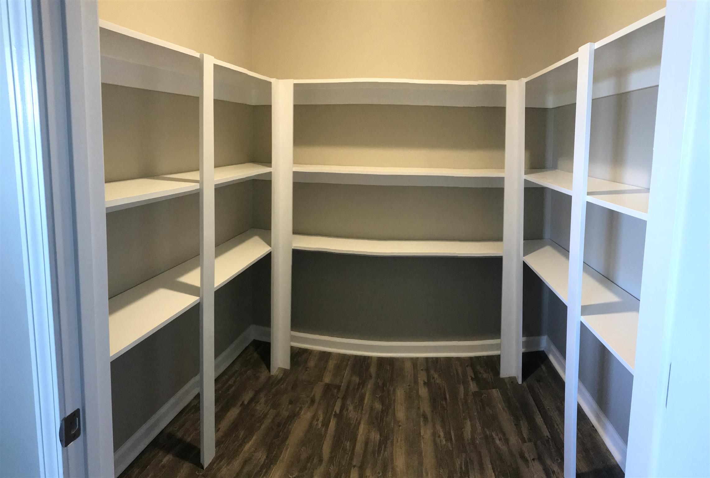 143 A T G T Road Portland, TN 37148 - Photo 8 of 13 a room with walk in closet and wooden floor