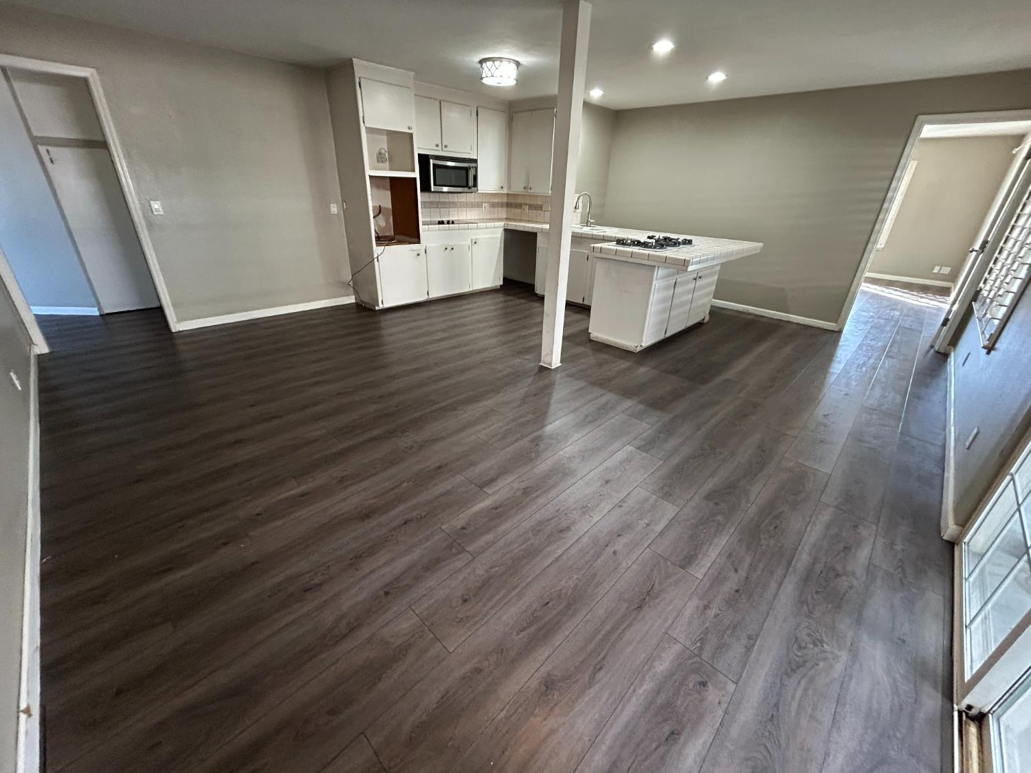 2581 Ballantyne Drive Merced, CA 95341 - Photo 3 of 16 a kitchen with a sink and a refrigerator