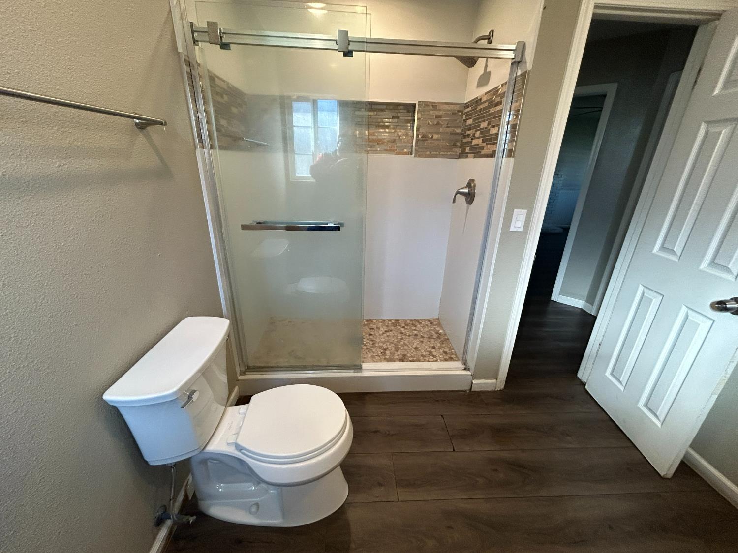 2581 Ballantyne Drive Merced, CA 95341 - Photo 7 of 16 a white toilet sitting next to a bathroom sink