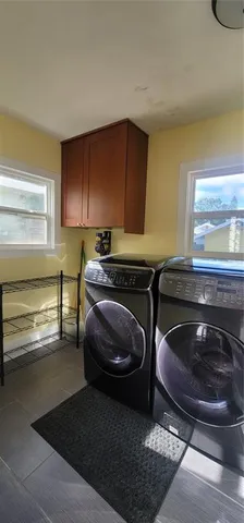 a kitchen with a sink a stove and a window