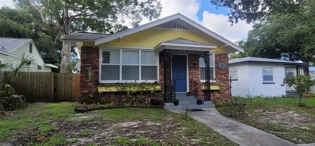 a view of a house with garden and yard