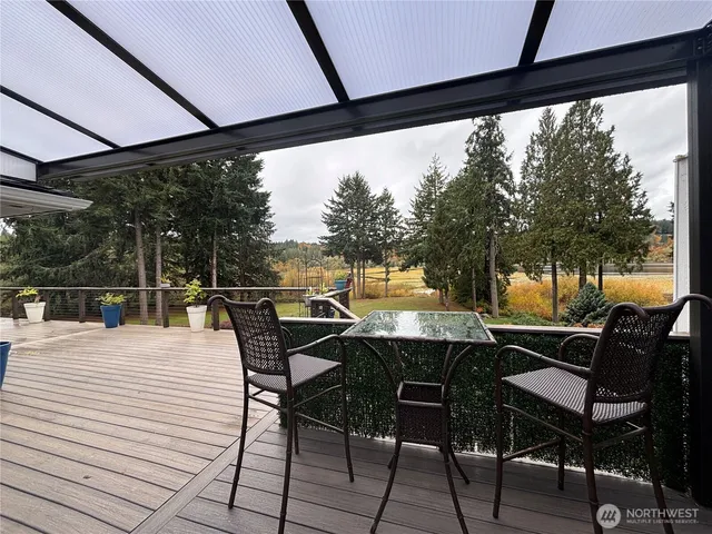 a dining space with furniture and wooden floor