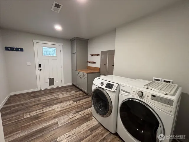 a view of a storage & utility room with washer and dryer