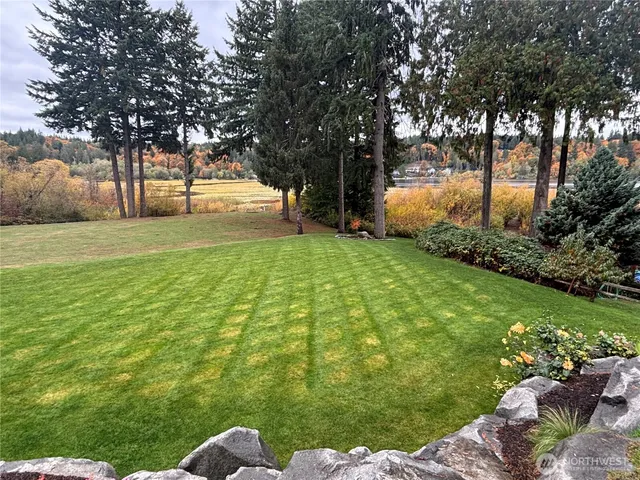 a view of a chairs and table in a yard