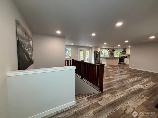 a view of kitchen center island and stainless steel appliances
