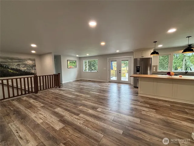 a view of a kitchen with a sink and cabinets